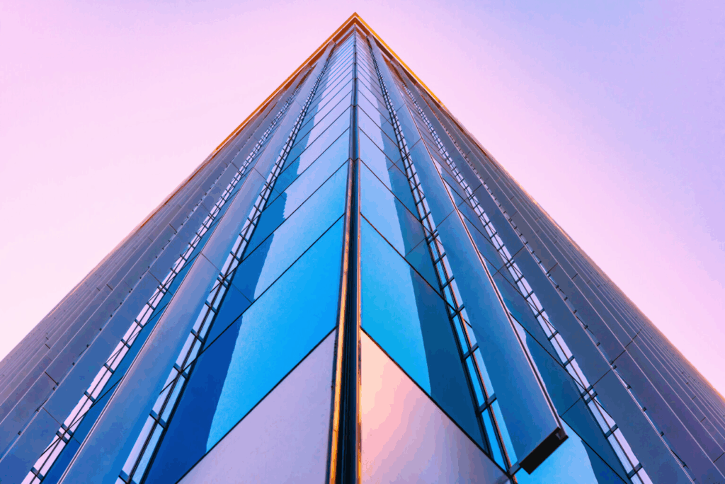 geometric image of the corner of a building with a purple sunset in the background